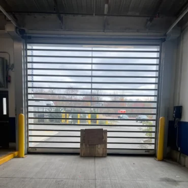 Modern glass commercial garage door – interior view Commercial